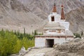 Buddhist chortens, white stupa and Himalayas mountains in the background near Leh in Ladakh, India Royalty Free Stock Photo