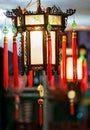 Buddhist decorative lanterns with red tassels hanging outdoors at night as street lighting for Chinese New Year holiday celebratio Royalty Free Stock Photo