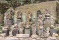 Buddhist deities and monks around the Saigoku Kannon bodhisattva in Mount Nokogiri. Royalty Free Stock Photo