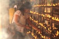 Buddhist devotee burn incense sticks