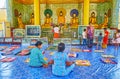 Buddhist devotees in Image house of Shwemawdaw Paya, Bago, Myanmar