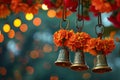 Buddhist golden bell hanging on festival background with orange marigold flowers. Ritual hand bell in Buddhist temple Royalty Free Stock Photo
