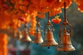 Buddhist golden bell hanging on festival background with orange marigold flowers. Ritual hand bell in Buddhist temple Royalty Free Stock Photo