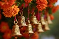 Buddhist golden bell hanging on festival background with orange marigold flowers. Ritual hand bell in Buddhist temple Royalty Free Stock Photo