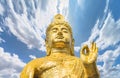 Peaceful Buddhist golden kannon bodhisattva goddess of mercy making a mudra.