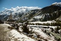 A Buddhist Gompa or Stupa on the Annapurna circuit route near Manang village on snow peaks background. Trekking in Nepal Royalty Free Stock Photo