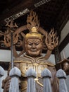 Buddhist guardian deity statue inside the gates of Nankobo, temple number 55 of Shikoku Royalty Free Stock Photo