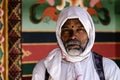 Buddhist Hindu Pilgrim with covered head in a Tibetan Buddhist temple in Kagbeni