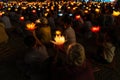 Buddhist hold lanterns and garlands praying at night on Vesak day for celebrating Buddha`s birthday in Eastern culture
