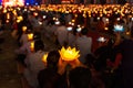 Buddhist hold lanterns and garlands praying at night on Vesak day for celebrating Buddha`s birthday in Eastern culture