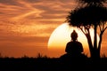 Buddhist Holiday Magha Puja, Asanha Puja, Visakha Puja Day Concept. Buddha Sitting under Tree on Golden Sunset Background. 3d