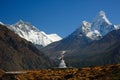 Buddhist Khumjung Stupa, Lhotse Peak and Ama Dablam Peak in Nepal Royalty Free Stock Photo