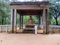 Buddhist man praying near Samadhi Statue Royalty Free Stock Photo