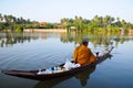 Buddhist monk alms round in the morning by boat Royalty Free Stock Photo