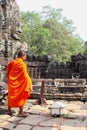 Buddhist monk ancient Bayon temple Angkor, Cambodia