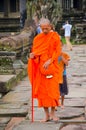 Buddhist monk at Angkor Wat Temple, UNESCO World Heritage, Siem Reap Province, Cambodia. September 3, 2015 Royalty Free Stock Photo