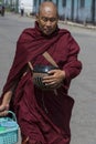 Buddhist monk with begging bowl