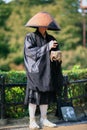 Buddhist monk chanting sutras and collecting donations in the Kyoto street. Japan Royalty Free Stock Photo