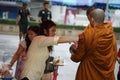 Buddhist monks alms on Bangkok`s streets