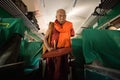 Buddhist monk collects donations on train