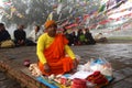 A Buddhist monk does religious rituals in front of Mayadevi temple Royalty Free Stock Photo