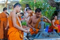 Buddhist young monks doing handcrafts in the temple yard