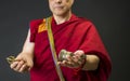 Tibetan monk with ritual attributes of vajra and dharma bell Royalty Free Stock Photo