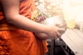Buddhist monk holdind monk's alms bowl Royalty Free Stock Photo
