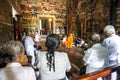 A Buddhist monk holds court in the shrine room at Kelaniya Raja Maha Vihara in Sri Lanka.