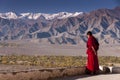 Buddhist monk looks at the Indus valley, Ladakh, India