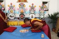 Buddhist monk making sand mandala.