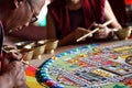 Buddhist monk making sand mandala