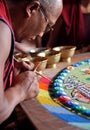 Buddhist monk making sand mandala