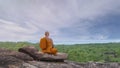 Buddhist monk in meditation at beautiful nature background Royalty Free Stock Photo