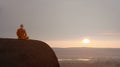 Buddhist monk in meditation at beautiful sunset or sunrise background Royalty Free Stock Photo