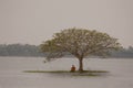 Buddhist monk in meditation beside the river Royalty Free Stock Photo