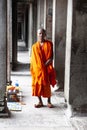 Buddhist monk posing for picture