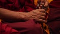 Buddhist monk praying - hands and beads rosary