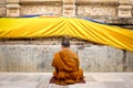 Buddhist monk praying and meditating.