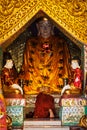 Buddhist monk praying in Shwedagon pagoda