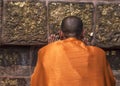 Buddhist monk prays at the Dhamekh Stupa.