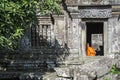 Buddhist monk in preah vihear ancient temple ruins in cambodia