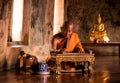 Buddhist monk reading book