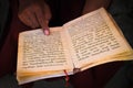 Buddhist monk reads scriptures, Kathmandu, Nepal