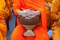 Buddhist monk`s bowl in hands. Royalty Free Stock Photo