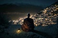 Buddhist monk sits on mountain top and looks at city and sky at night, generative AI
