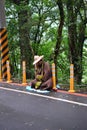 A Buddhist monk sitting at the street in Taiwan jungle Royalty Free Stock Photo