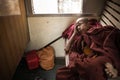 Buddhist monk sleeps on wooden train seat