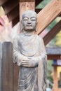 Buddhist monk statue with hands folded over one another Royalty Free Stock Photo