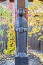 Buddhist Monk statue holding alms bowl looking up Royalty Free Stock Photo